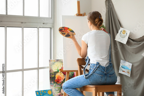 Female artist painting pict...