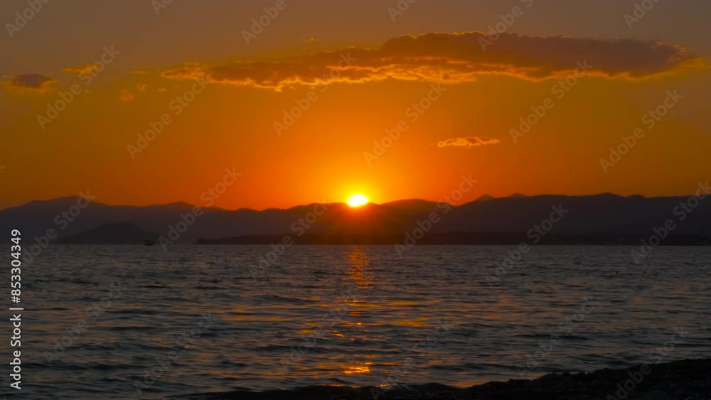 Natural sea place during nightfall. A view of natural sea place with sun reflection on waves during warm dusk time.