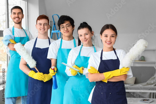Group of young janitors wit...