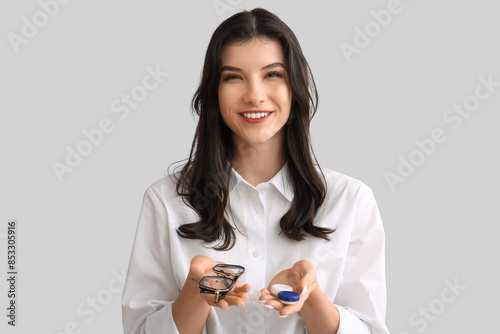 Happy smiling young woman h...