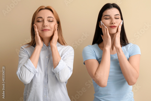 Beautiful women doing face ...