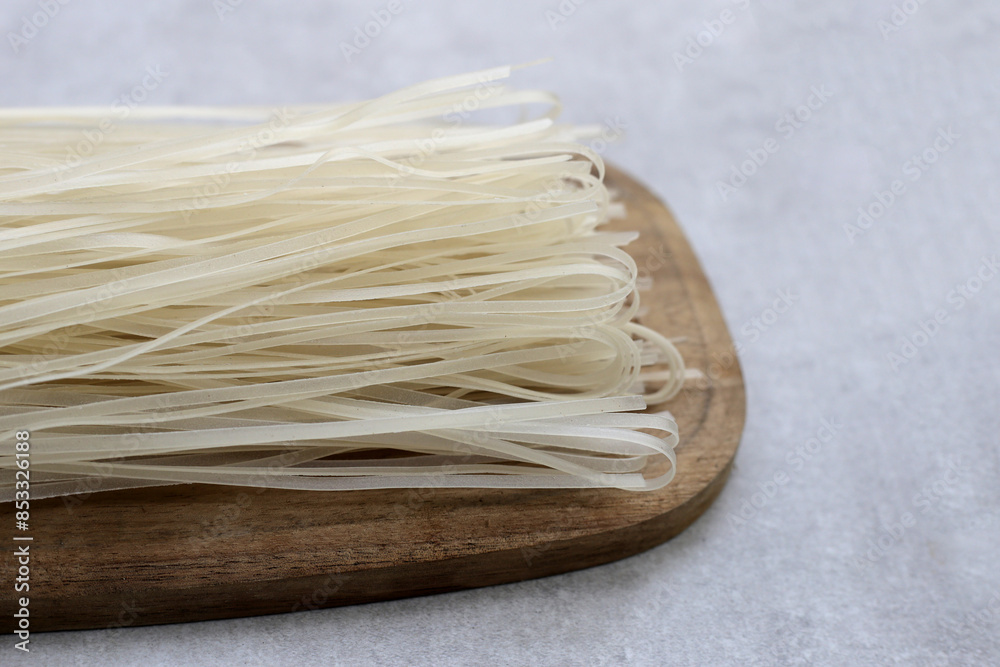 Dried uncooked rice noodles. Raw rice flour noodles Dried uncooked rice noodles. Raw rice flour noodles