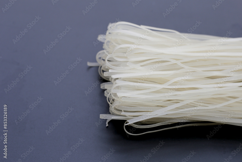 Dried uncooked rice noodles. Raw rice flour noodles Dried uncooked rice noodles. Raw rice flour noodles