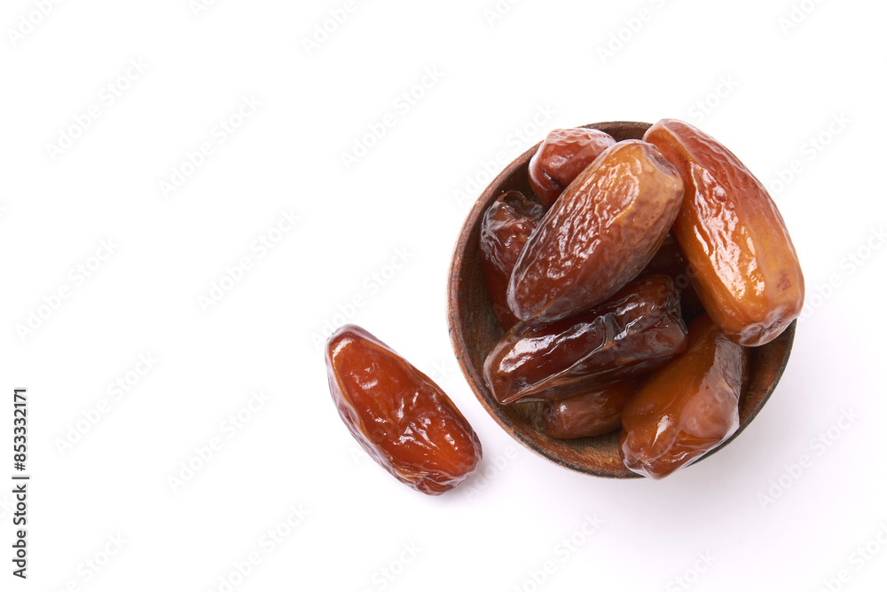 Dried dates fruits in wooden bowl