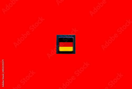 Flag of Germany on a simple square button on a solid red background. German language course training school symbol, history and culture education and discovery, country national symbols minimal design