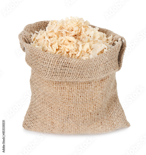 Natural sawdust in burlap sack isolated on white