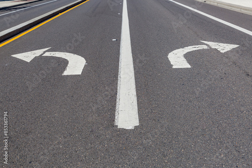 Wallpaper Mural Directional arrows pointing left and right painted on a highway. Torontodigital.ca