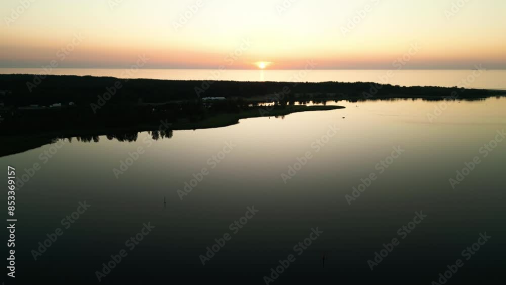 Aerial drone shows sunrise over lake, natures beauty reflected in tranquil waters. Serene and breathtaking scene Aerial drone shows sunrise over lake, natures beauty reflected in tranquil waters. Serene and breathtaking scene