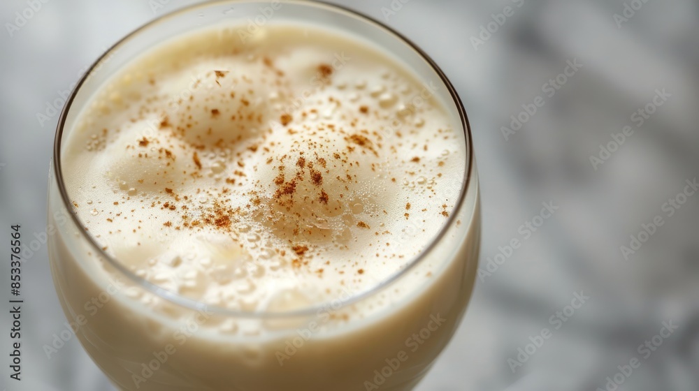 A Glass of Creamy Eggnog with Cinnamon A Glass of Creamy Eggnog with Cinnamon