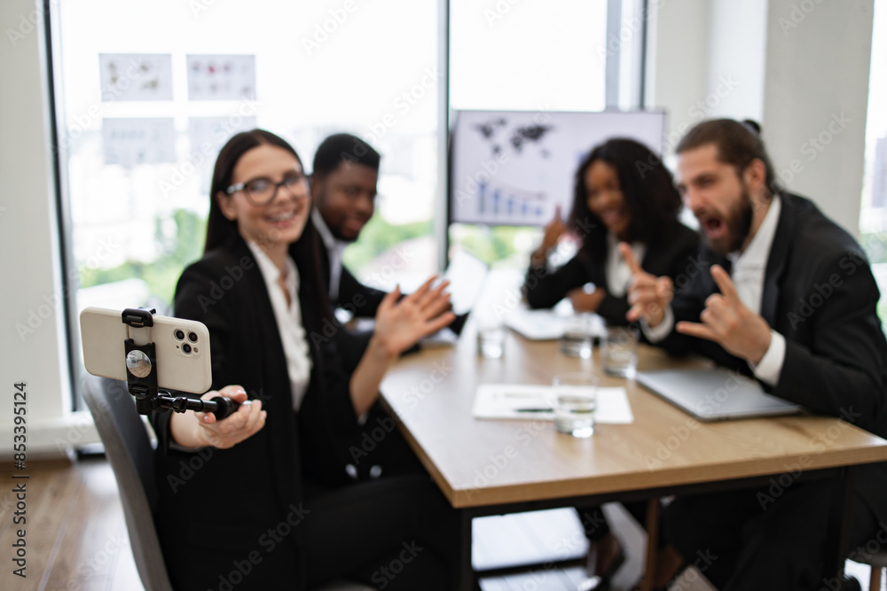 Group of business colleagues taking selfie during office meeting. Team of four diverse professionals smiling and having fun at workplace. Concept of teamwork, corporate culture, and communication. Group of business colleagues taking selfie during office meeting. Team of four diverse professionals smiling and having fun at workplace. Concept of teamwork, corporate culture, and communication.