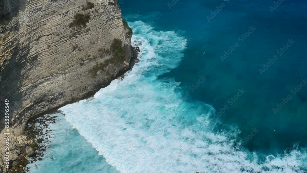 Turquoise ocean sea water white wave pattern splashing deep blue sea. Seascape dark ocean background wave splash on rock. Tropical sea beach in summer seaside outdoor. Water Surface blue wave pattern Turquoise ocean sea water white wave pattern splashing deep blue sea. Seascape dark ocean background wave splash on rock. Tropical sea beach in summer seaside outdoor. Water Surface blue wave pattern