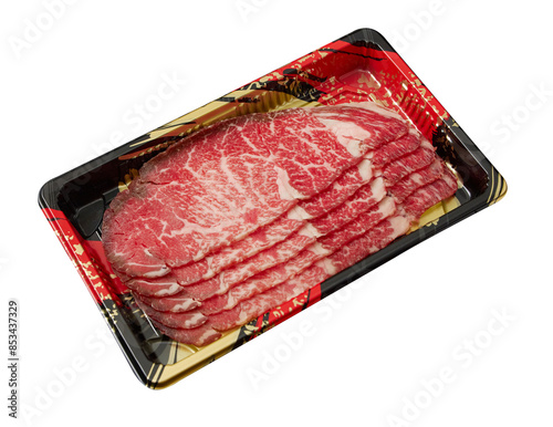 Thinly sliced ​​fresh Beef with a high layer of fat arranged on a  tray isolated on white background.