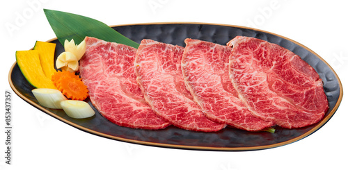 Chuck Eye Sliced is beautifully arranged with a set of vegetables (Slice the pumpkin, garlic, Japanese leeks and carrots) served on a black plate isolated on white background.