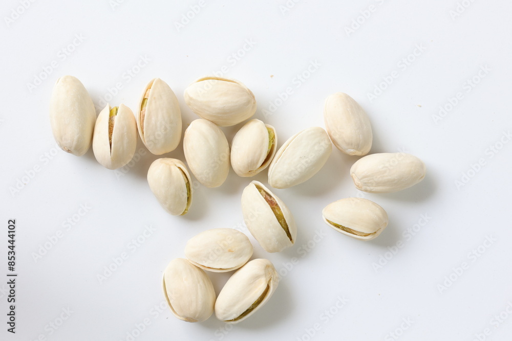pistachio nuts on white background pistachio nuts on white background