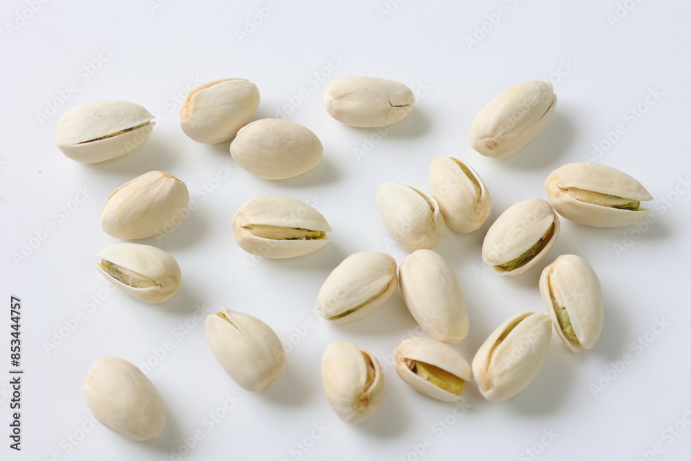 pistachio nuts on white background pistachio nuts on white background