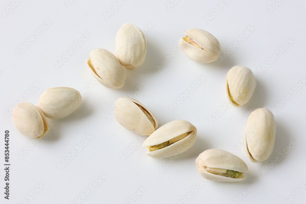 pistachio nuts on white background pistachio nuts on white background