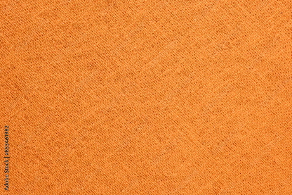 Fototapeta premium orange hemp viscose natural fabric cloth color, sackcloth rough texture of textile fashion abstract background