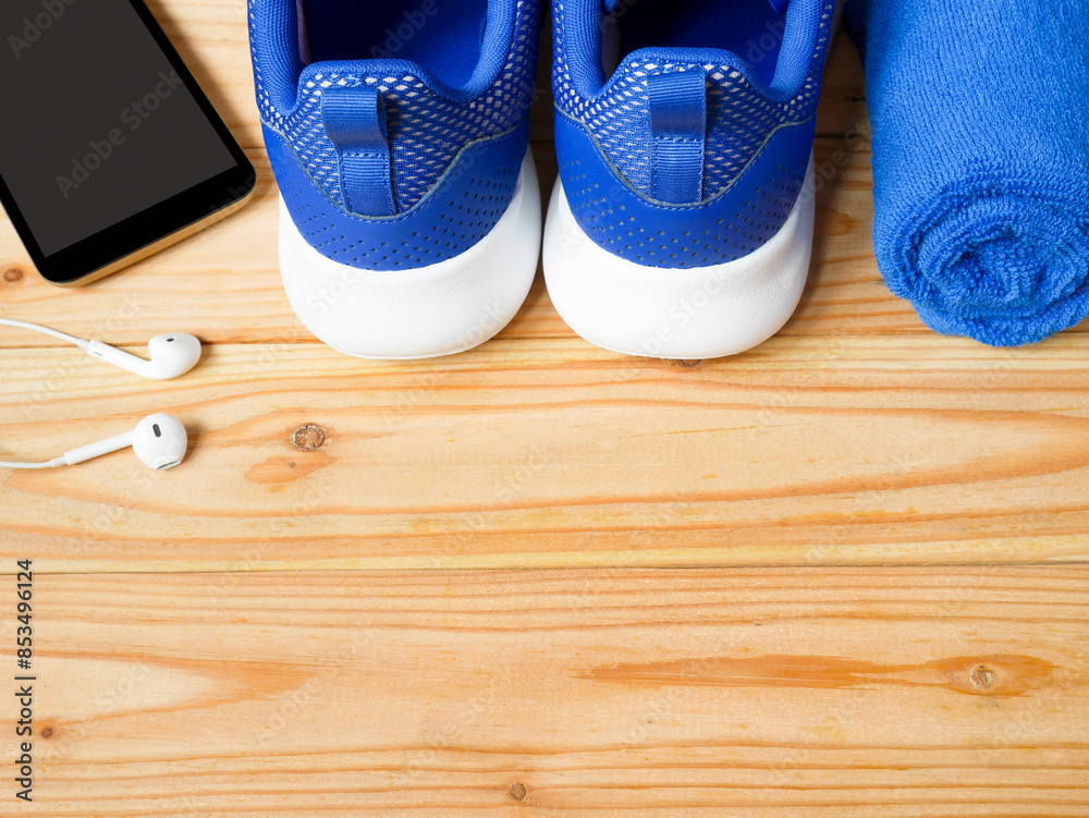 Sneakers, mobile phone, earphones and towel Sneakers, mobile phone, earphones and towel
