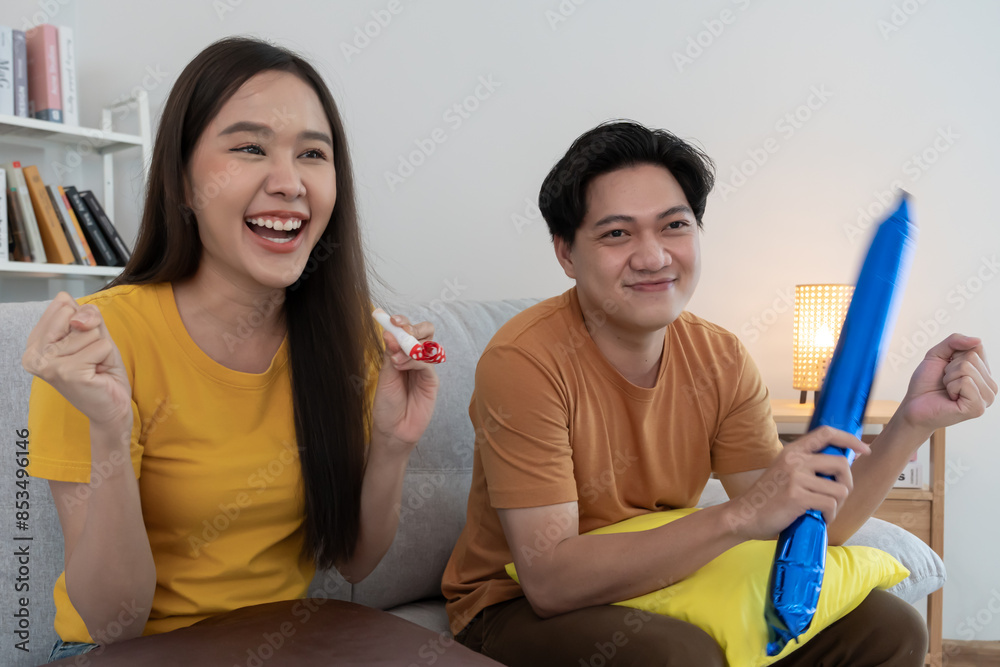 cheerful couple cheer sport, watching sporting, cheering for victory of their team. Happy energetic smiling. tv show, holiday, relax, recreation, soccer, football, series, cinema, cheer, win, fan club cheerful couple cheer sport, watching sporting, cheering for victory of their team. Happy energetic smiling. tv show, holiday, relax, recreation, soccer, football, series, cinema, cheer, win, fan club