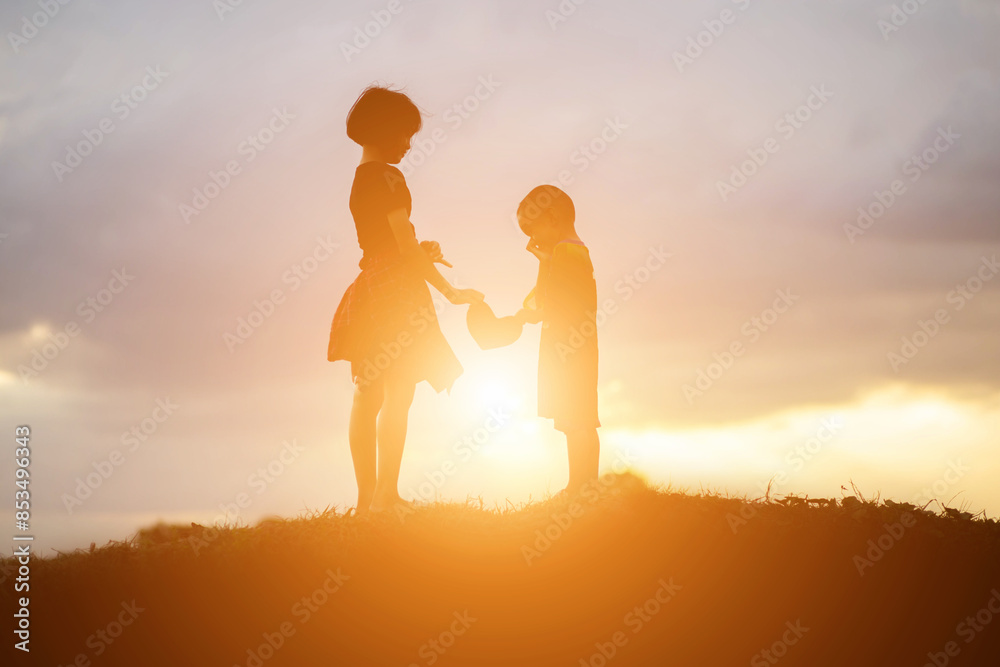 silhouette of a happy children and happy time sunset silhouette of a happy children and happy time sunset