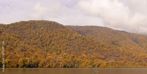 Beautiful lake with yellow trees on the mountain. Lake Garanohur. Gabala region. Azerbaijan. photo