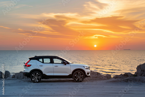 Compact SUV with sport design parked by the sea at sunset, showcasing automotive lifestyle © Emanuel