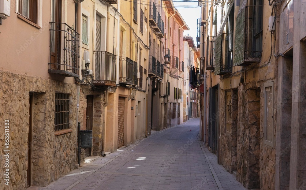 Narrow streets and rustic stone houses in the medieval village of Molina de Aragon. Narrow streets and rustic stone houses in the medieval village of Molina de Aragon.