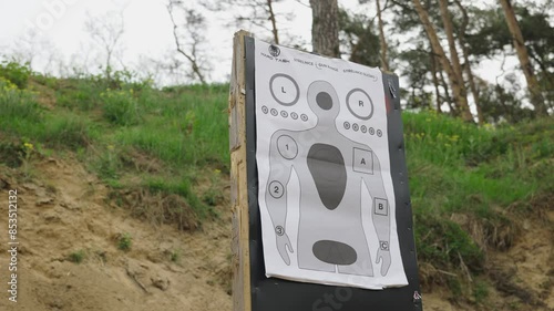 Low angle view of paper target with human silhouette at Olesko shooting range photo