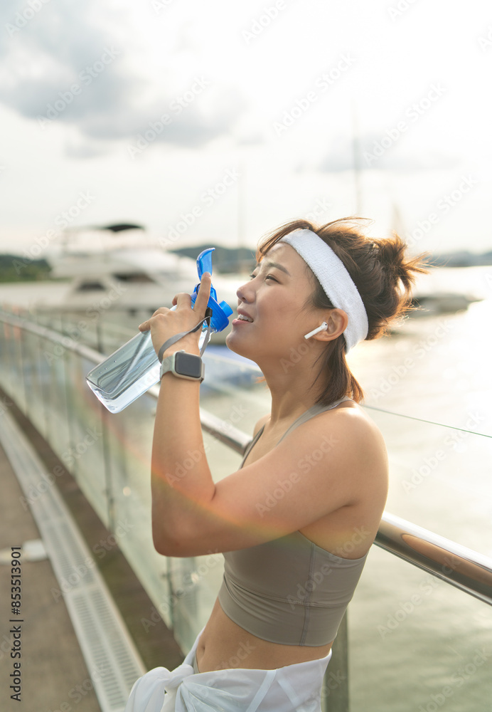 a woman who works out at a riverside park