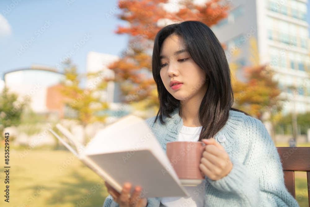 girl reading and studying on school compus girl reading and studying on school compus