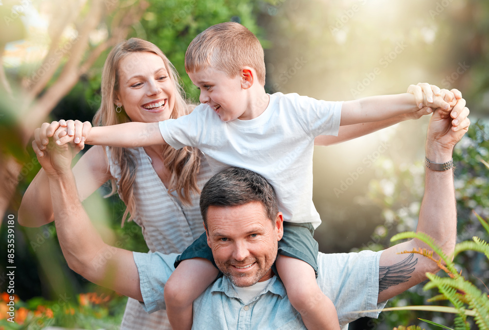Fototapeta premium Child, shoulder and happy family in outside together, parents and boy in garden for bonding on weekend break. Summer, love and smile for care on holiday, nature trees and support or playful backyard