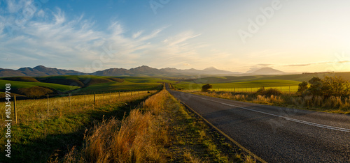 The R326 paved road near Stanforn with the  Kleinrivier Mountains in the background. Western Cape. South Africa