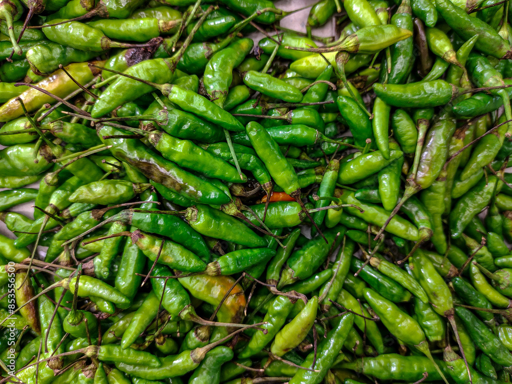 Fresh Green Bird's Eye Chili Peppers at a Local Market Fresh Green Bird's Eye Chili Peppers at a Local Market
