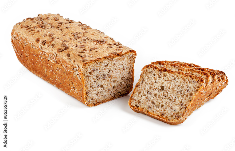 Freshly baked bread on wooden cutting board with ears of wheat.
