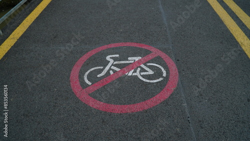 Bicycle sign on the road. Bike lane in the park.