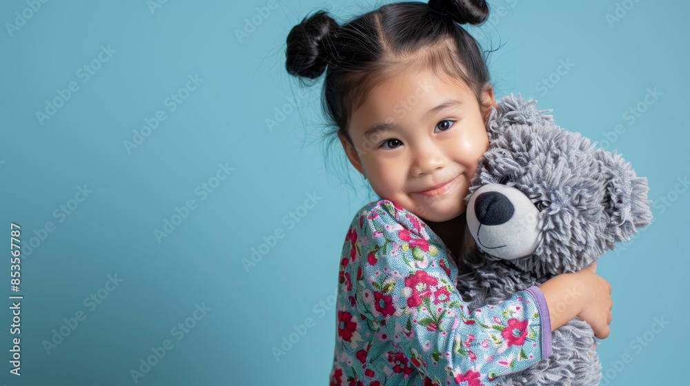 Fototapeta premium The Child Hugging Teddy Bear