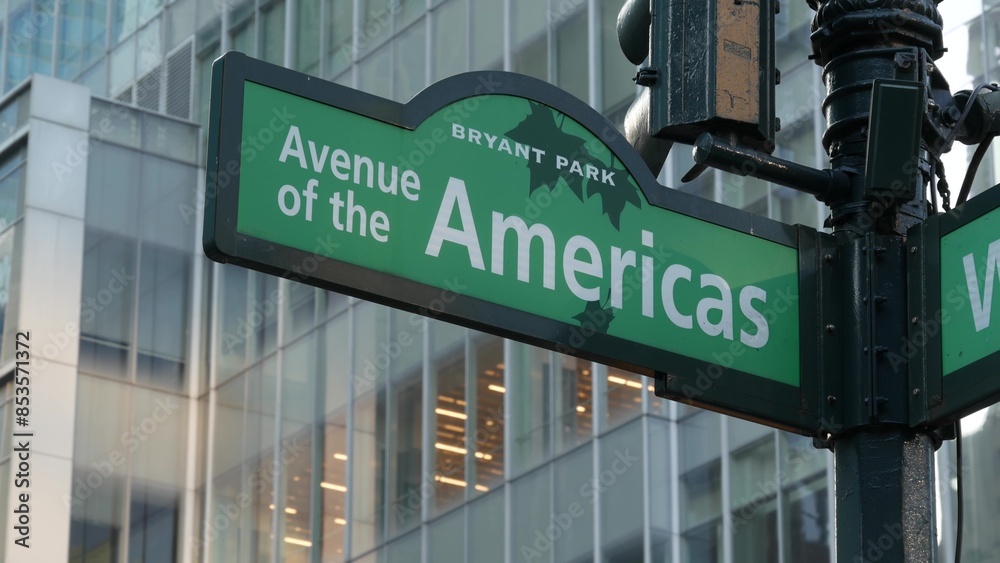 New York City crossroad, street intersection green road sign. 6 Sixth ave, Americas avenue corner, Midtown business district, United States. Highrise skyscraper architecture, Bryant park text roadsign New York City crossroad, street intersection green road sign. 6 Sixth ave, Americas avenue corner, Midtown business district, United States. Highrise skyscraper architecture, Bryant park text roadsign