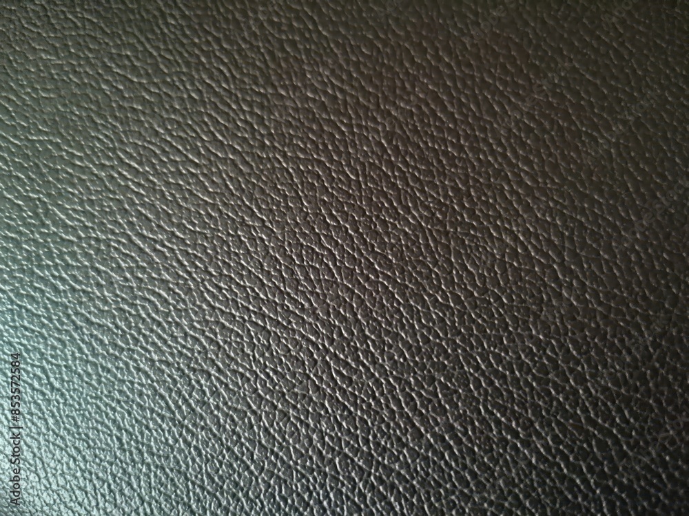 Dark black leather with uniform grain texture