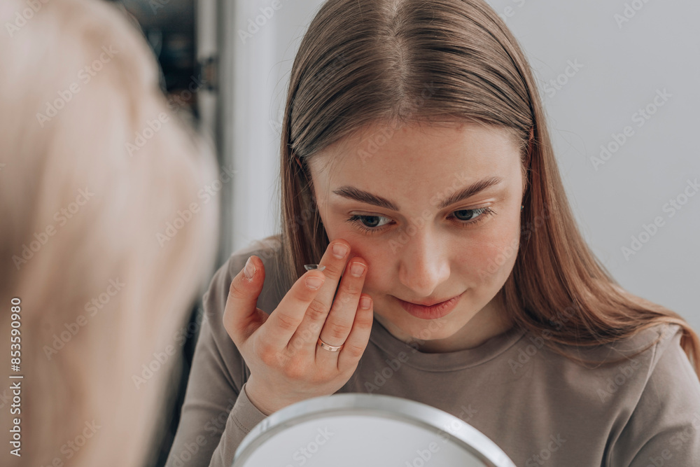 custom made wallpaper toronto digitalYoung woman trying to insert contact lens in eye at clinic