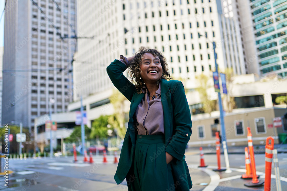 Happy young businesswoman with hand in hair looking away Happy young businesswoman with hand in hair looking away