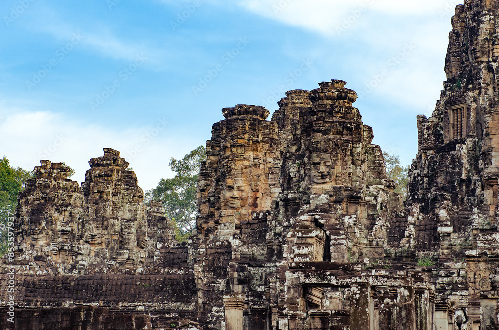The bayon temple smiling stone faces showing on a sunny day in angkor thom, siem reap, cambodia The bayon temple smiling stone faces showing on a sunny day in angkor thom, siem reap, cambodia