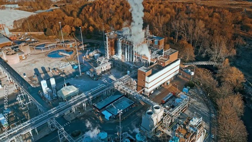 Aerial footage moving towards a large industrial chemical plant photo