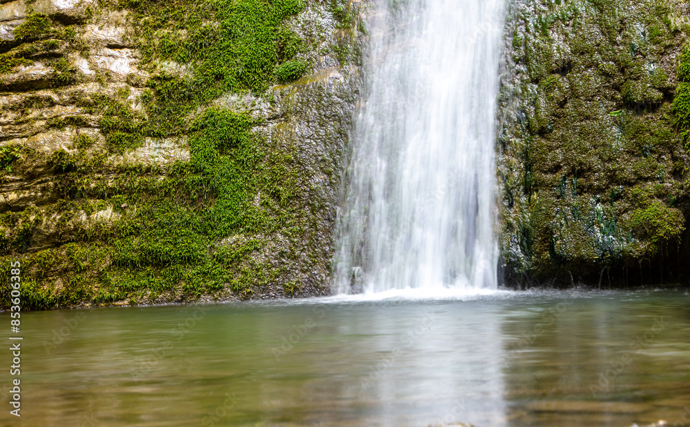 Naklejka premium Waterfall on the river in nature in summer