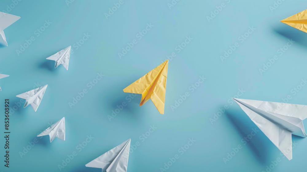 A yellow paper airplane flies off in a different direction, leaving behind white airplanes on a blue backdrop. A yellow paper airplane flies off in a different direction, leaving behind white airplanes on a blue backdrop.