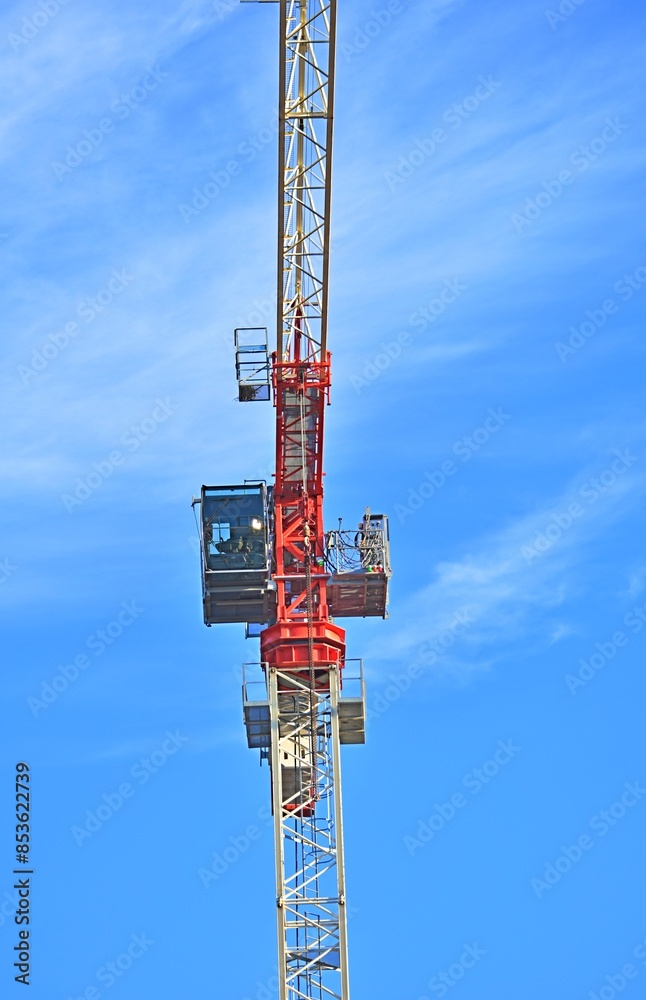 cabin in a construction crane against a blue sky background cabin in a construction crane against a blue sky background