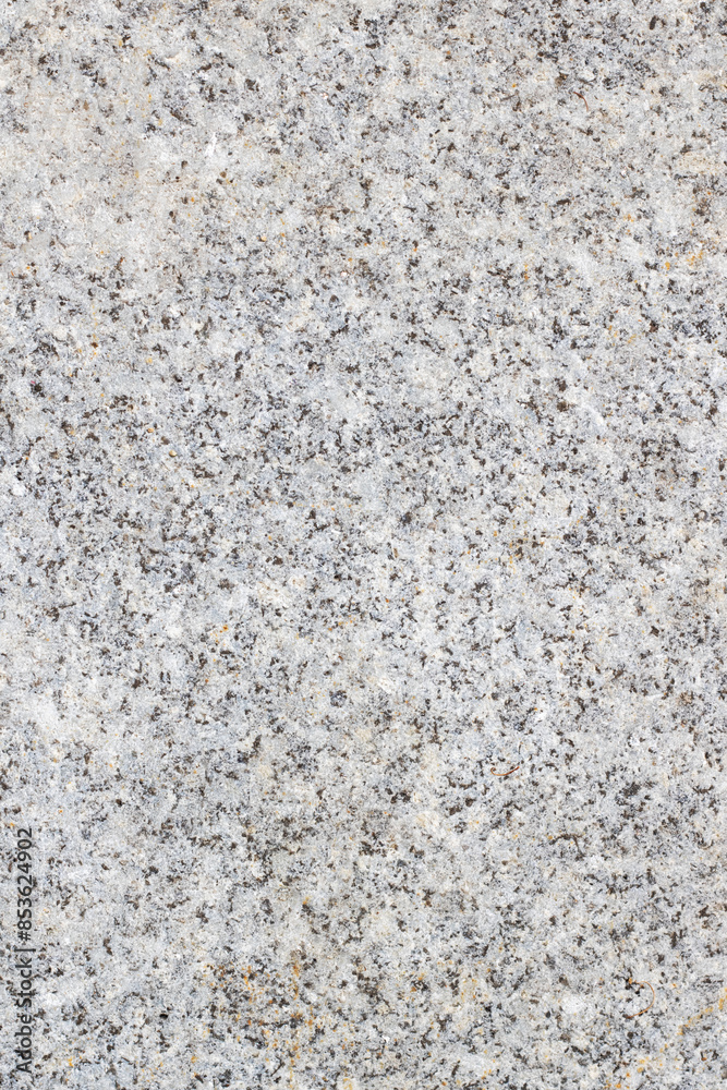 A close up image displaying a textured gray granite surface A close up image displaying a textured gray granite surface