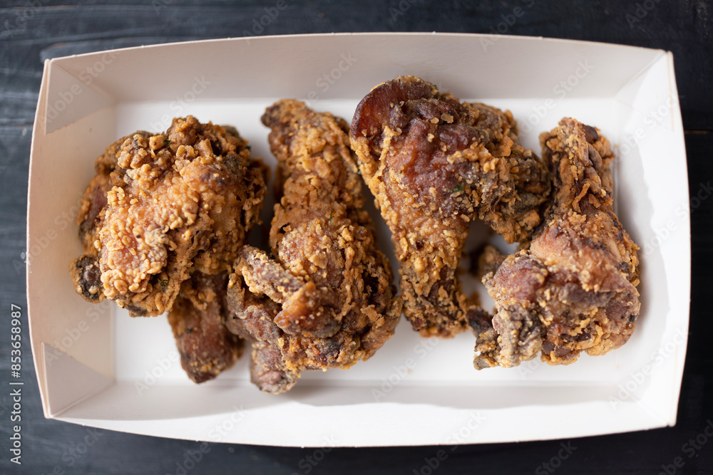 street food truck fried chicken wing drumlets in batter