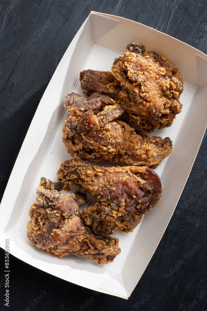 street food truck fried chicken wing drumlets in batter