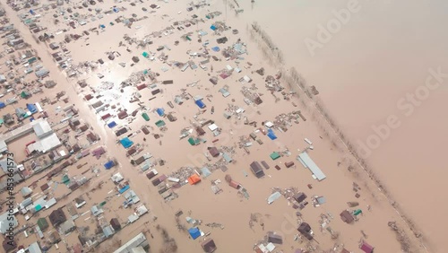 Flood. Damaged houses in the flood. The houses were washed away by the current of the water. A city destroyed by a flood. A natural disaster, an emergency. An environmental disaster. Damage, trouble.
