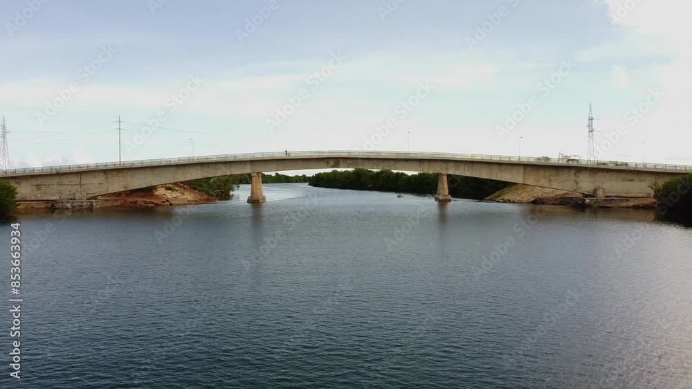 Drone Shot, Flying Over River At Low Altitude Then Passing Under Concrete Bridge Drone Shot, Flying Over River At Low Altitude Then Passing Under Concrete Bridge
